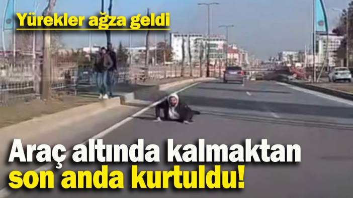 Araç altında kalmaktan  son anda kurtuldu