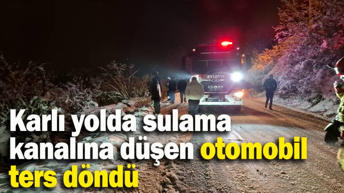 Düzce'de  feci kaza: Karlı yolda sulama kanalına düşen otomobil ters döndü