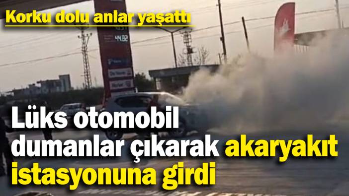 Lüks otomobil dumanlar çıkarak akaryakıt istasyonuna girdi