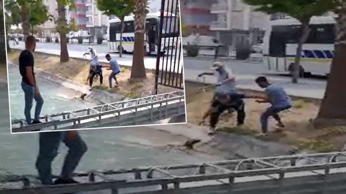 Kanala düşen köpeği kurtarmak isteyenleri zorlu mücadelesi
