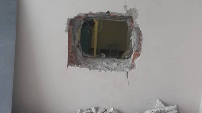 Bankayı soymak için yan binadaki duvarı deldi