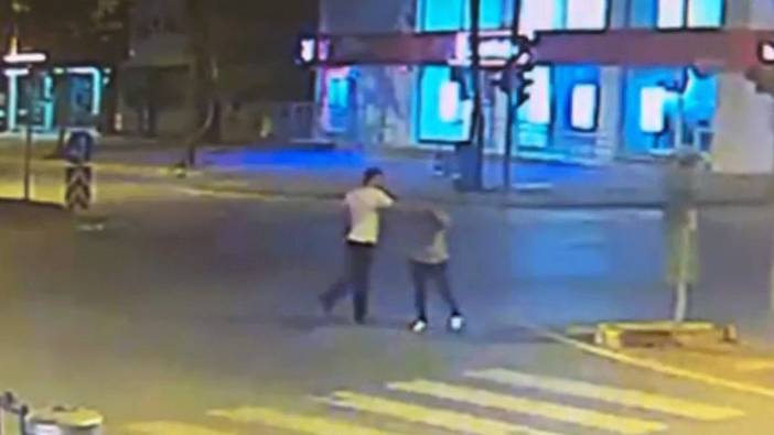 Elinde tabancayla eşini sokak ortasında darp etti