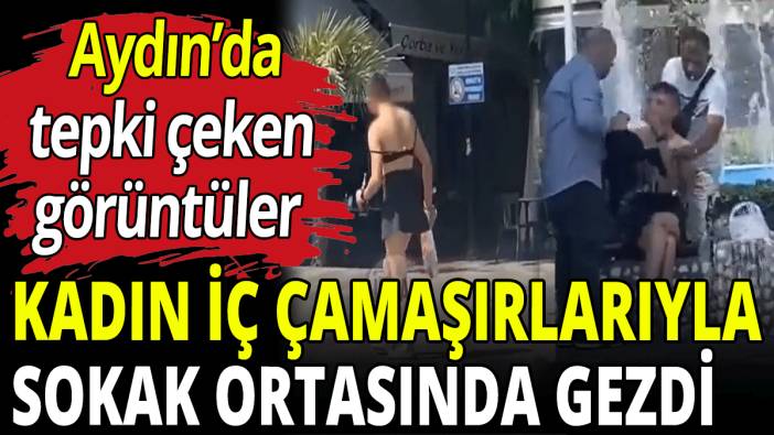 Kadın iç çamaşırlarıyla sokak ortasında gezdi