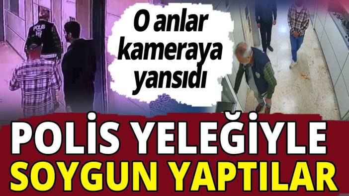 Polis yeleğiyle soygun yaptılar! O anlar kameraya yansıdı