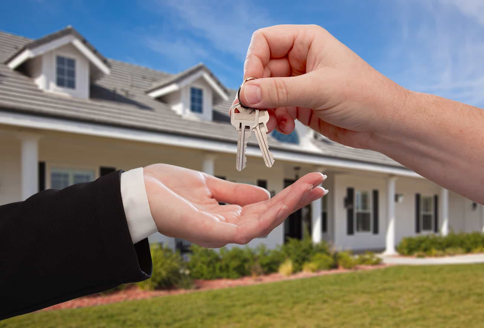 bigstock-handing-over-the-house-keys-in-11942051.jpg