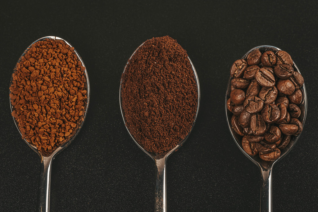 coffee-beans-ground-and-instant-coffee-granules-in-spoons-top-view.jpeg